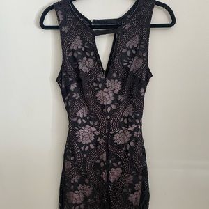 New friends Colony black/purple lace romper with cutout.